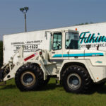 Forklift parked in front of adkins trailer
